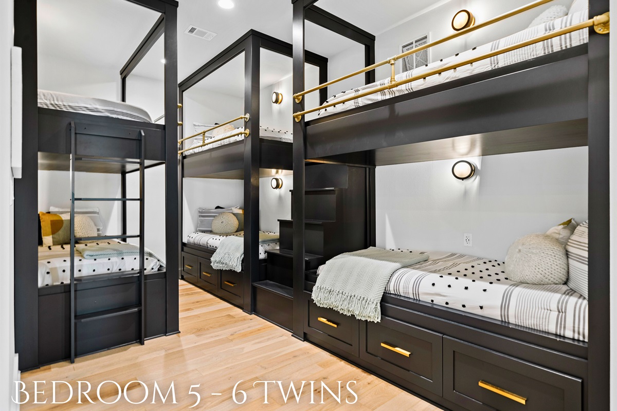 Perfect for kids or guests, this room features six cozy twin beds, each thoughtfully designed to provide a great night's sleep and personal space