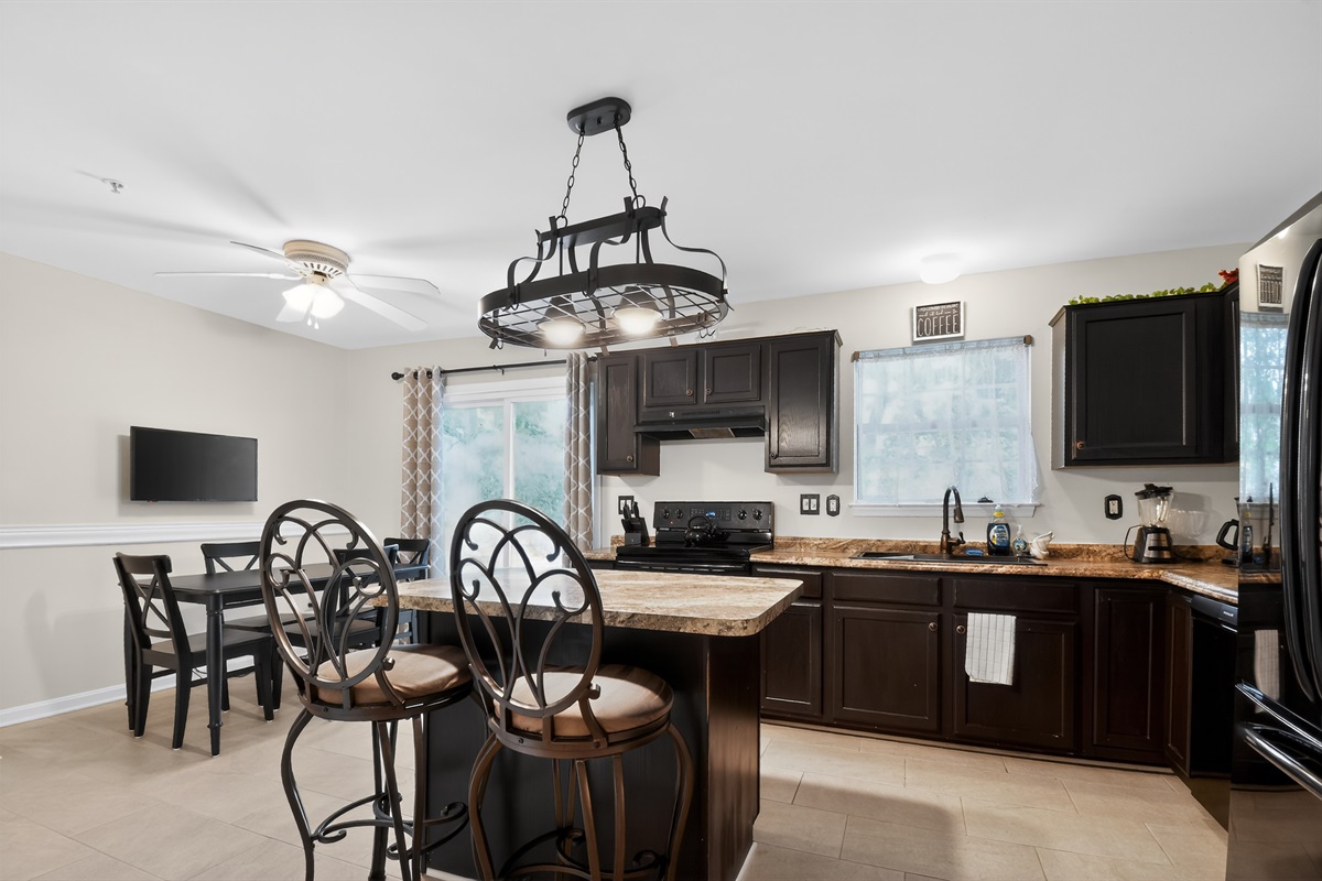 Chef-Ready Kitchen — Dark Cabinetry, Dining Adjacent, Ideal for Family Meal Prep