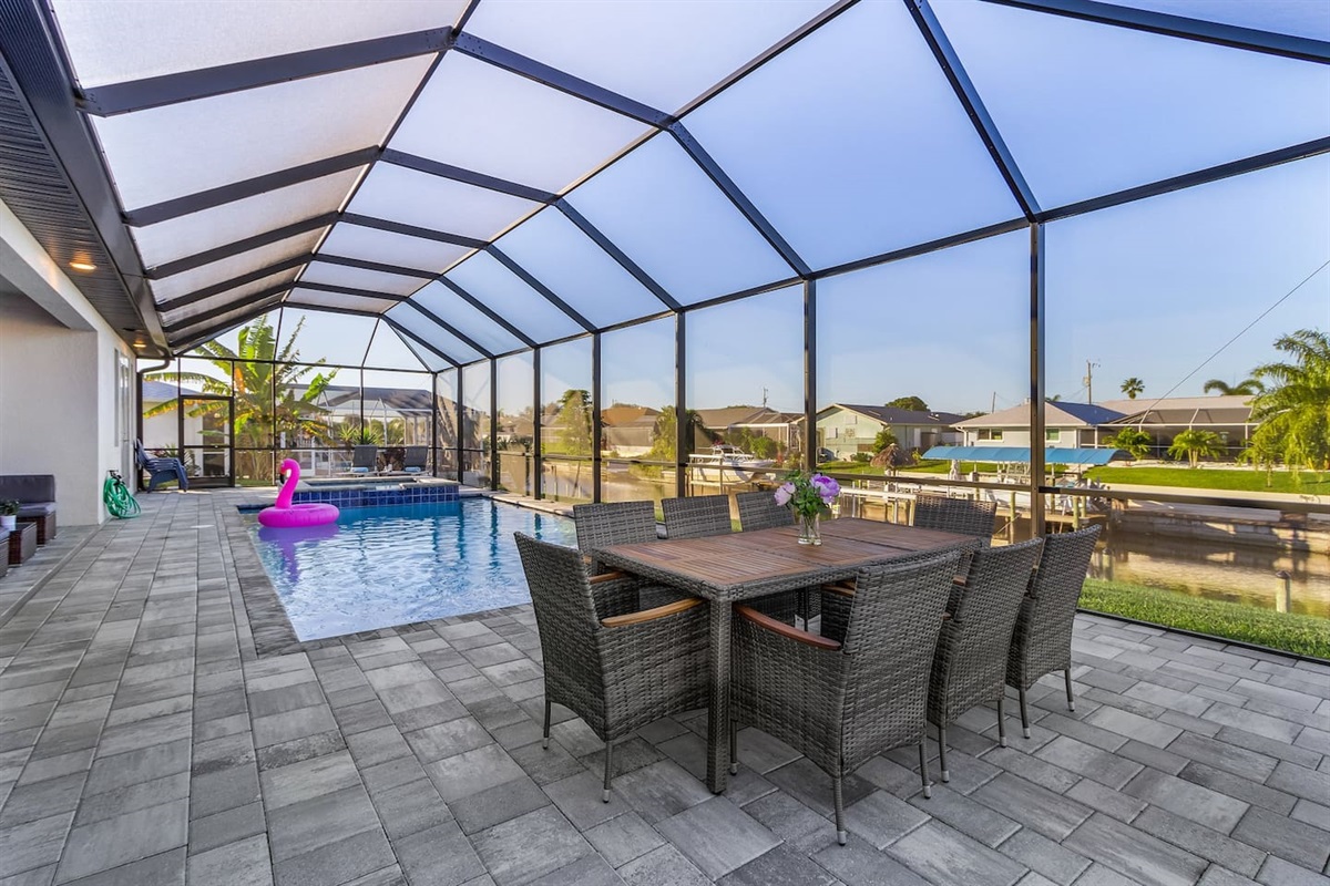 Enjoy outdoor dining with a spectacular pool and water views!