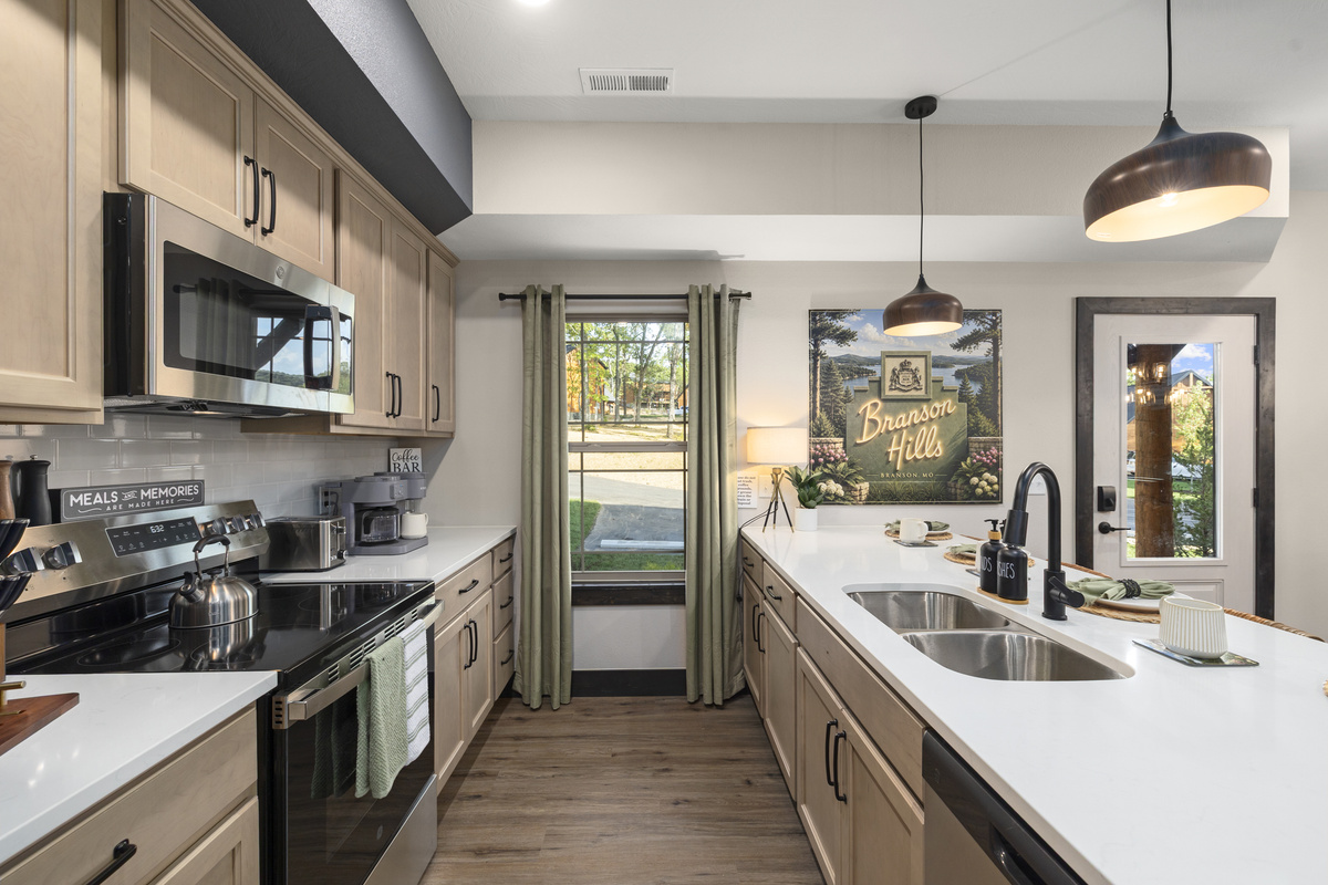 Bright quartz counters, stainless appliances, and room for a big group to cook.