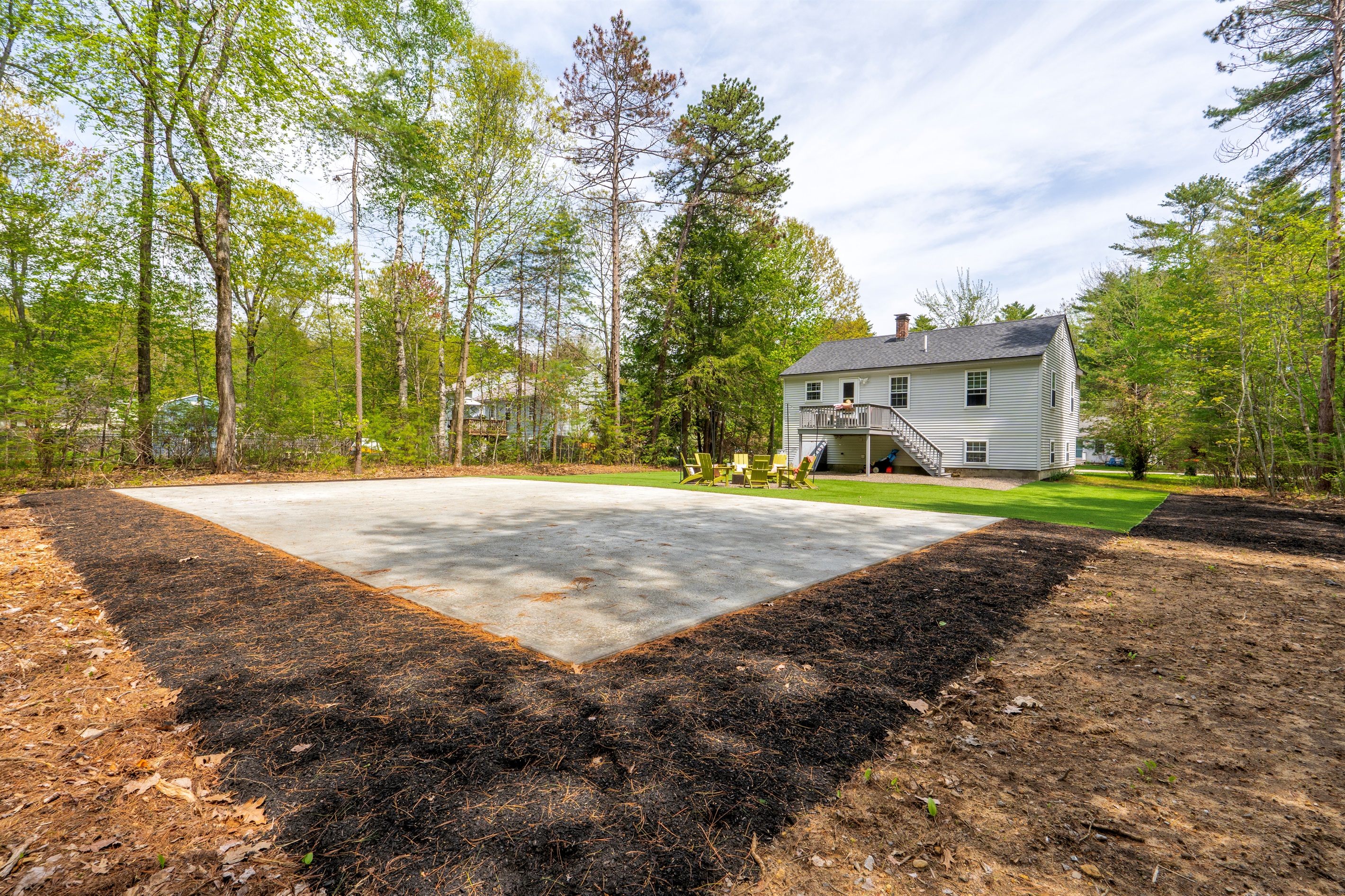 A spacious backyard featuring wide open green space, offering plenty of room for outdoor activities, gatherings, and relaxed time under the open sky.