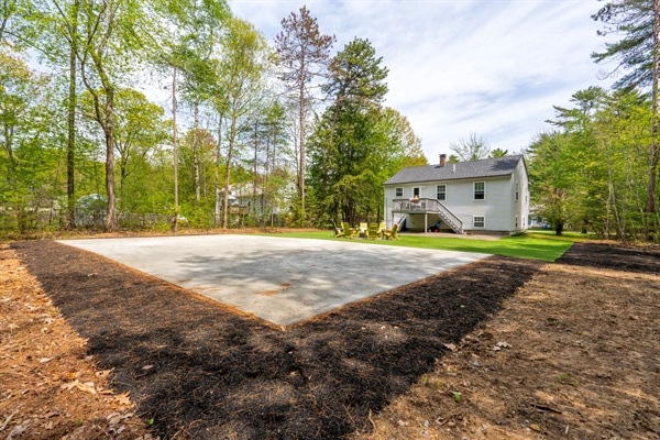 A spacious backyard featuring wide open green space, offering plenty of room for outdoor activities, gatherings, and relaxed time under the open sky.