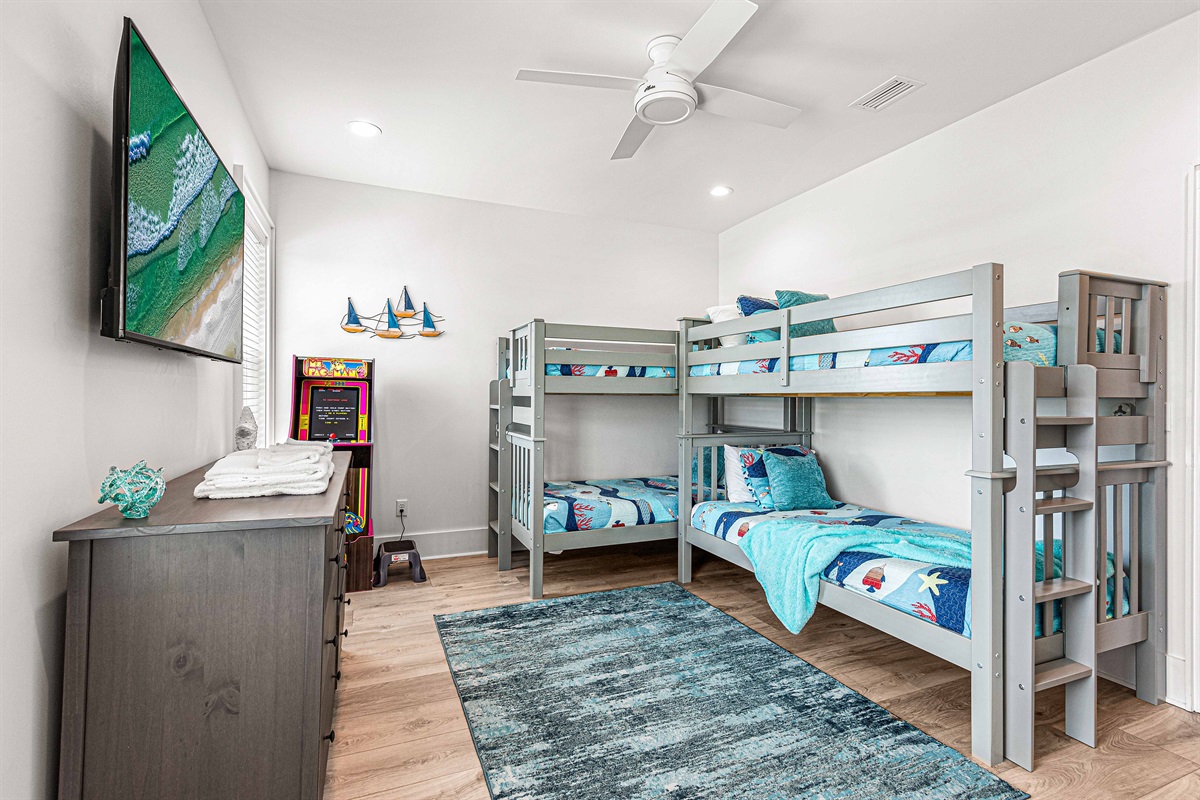 Sturdy twin bunks sleep 4 with Ms. PACMAN and 55" Smart TV with large private bath. Plenty of closet and dresser storage.