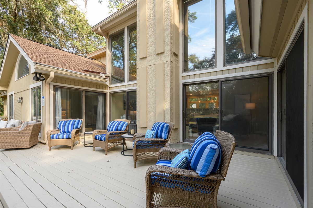 Plenty of seating on the large deck off living room and screened porch