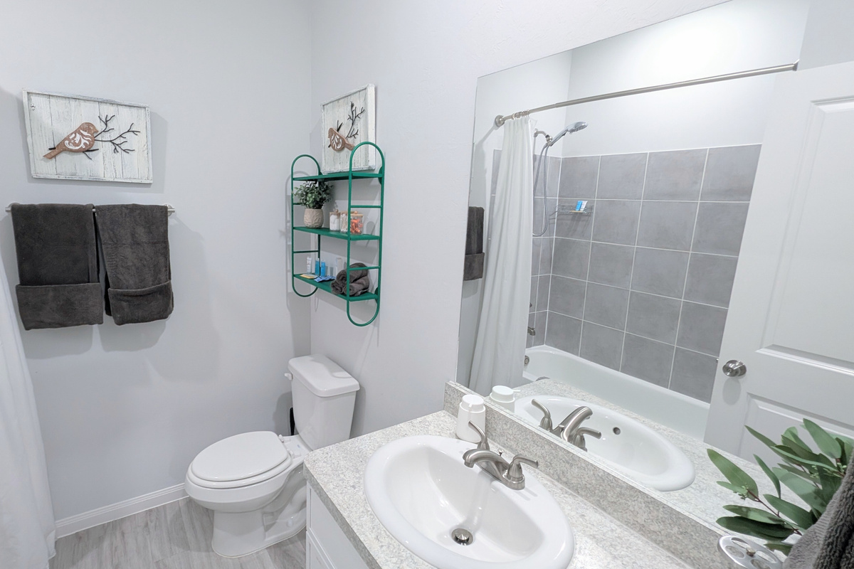 Upstairs full bathroom is spacious and stocked with toiletries and the comforts of home. 