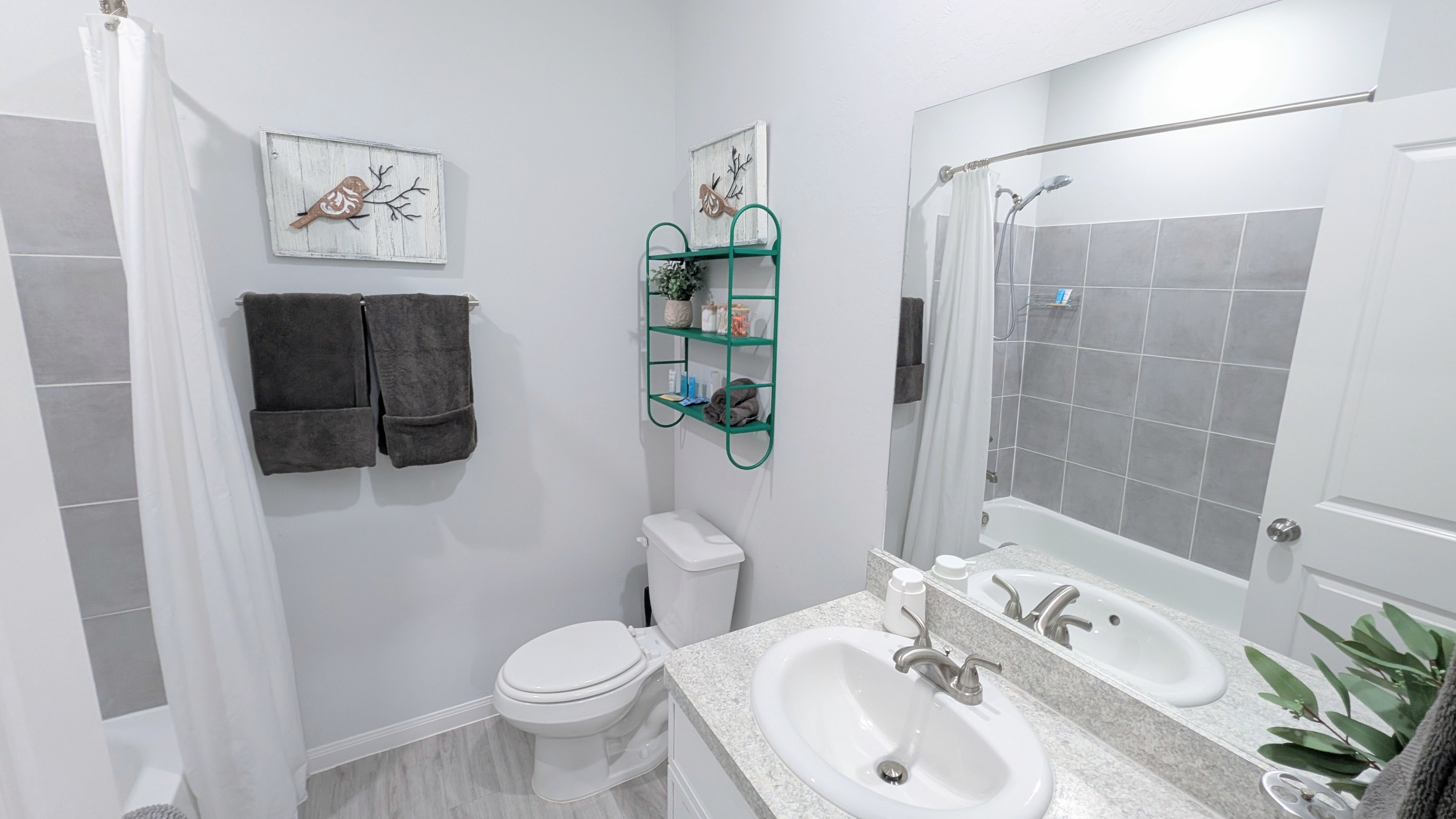 Upstairs full bathroom is spacious and stocked with toiletries and the comforts of home. 