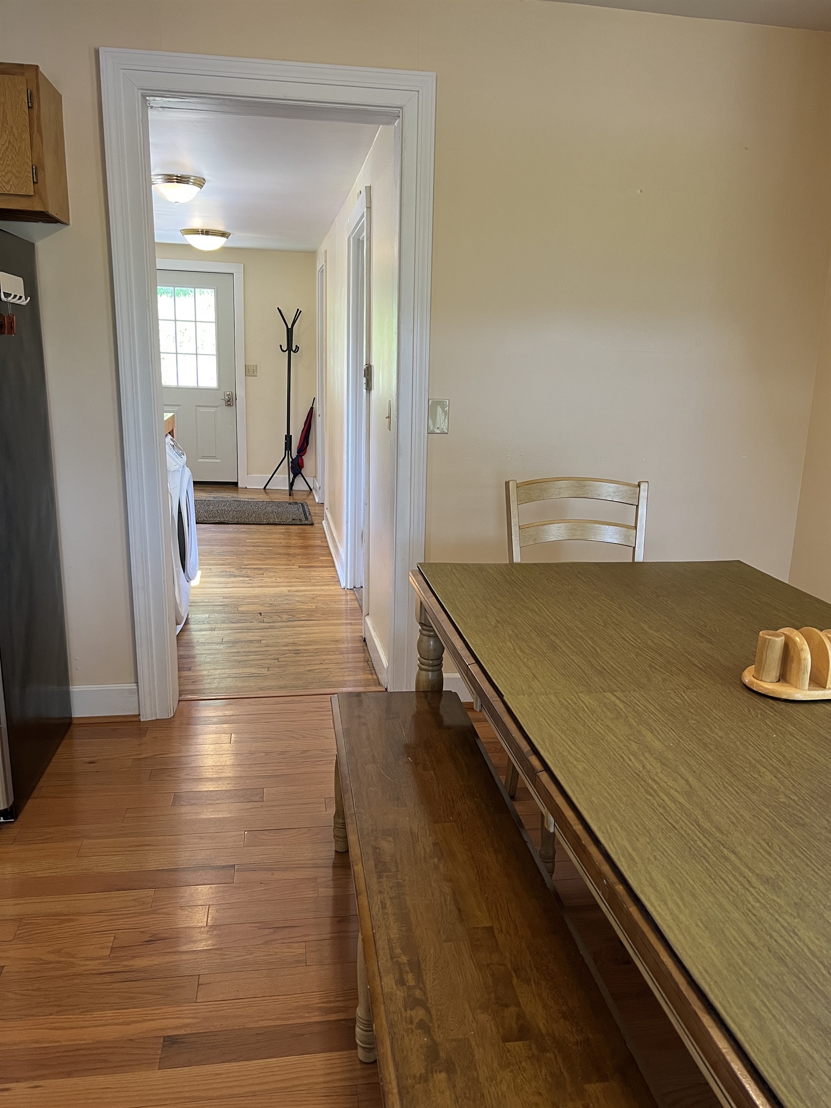 Dining area with laundry and hall to 2 baths beyond