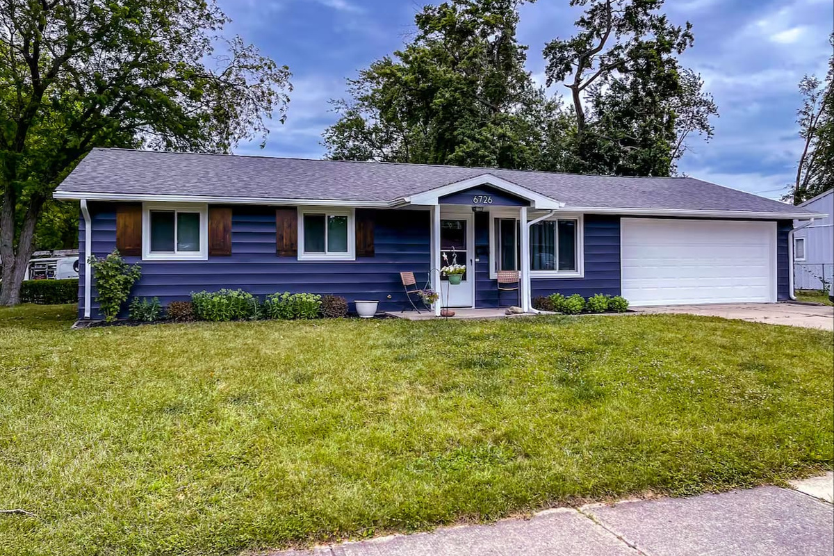 Classic ranch-style curb appeal with a manicured lawn welcomes you home the moment you pull in.