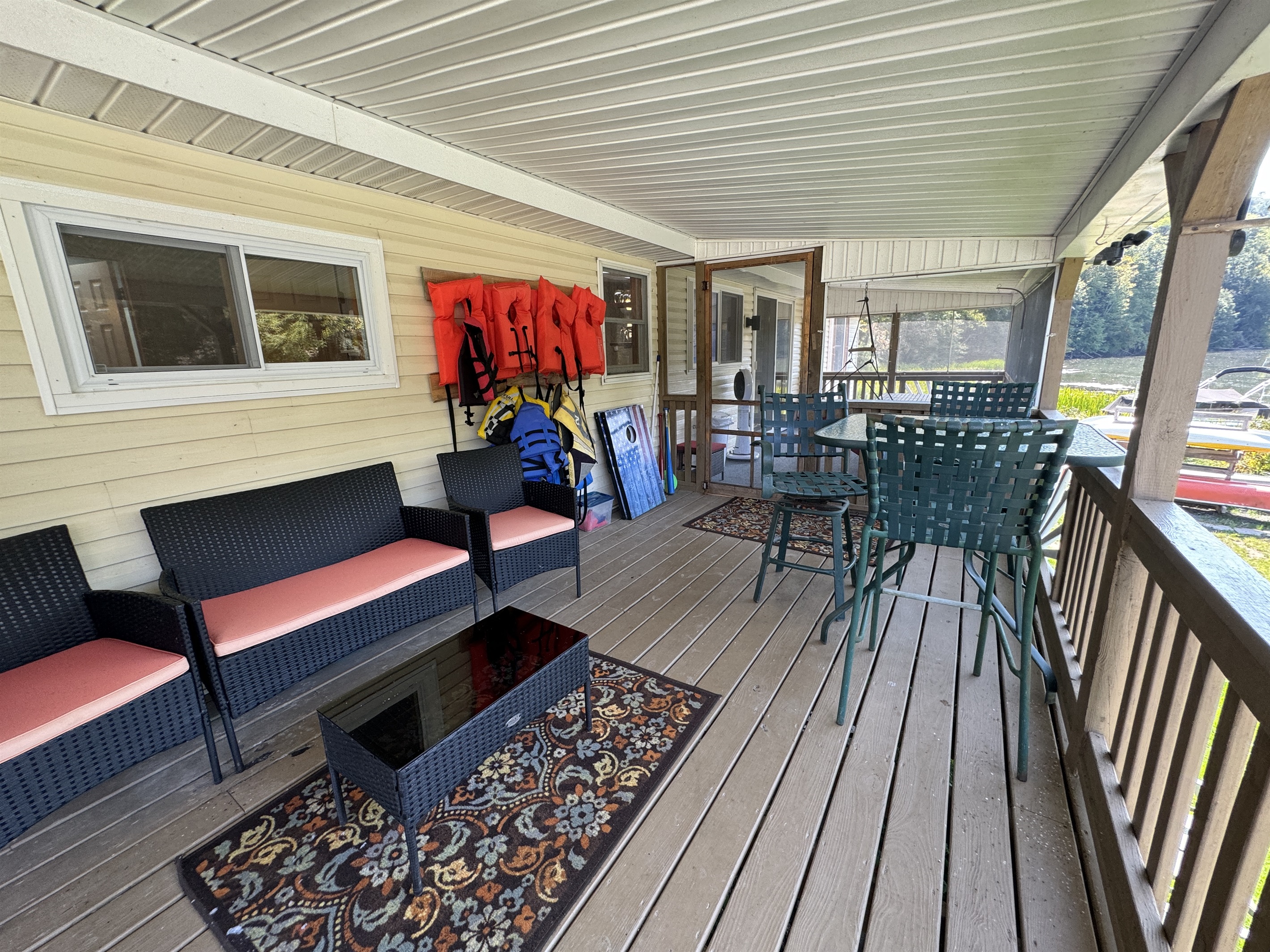 Covered back deck overlooking the water