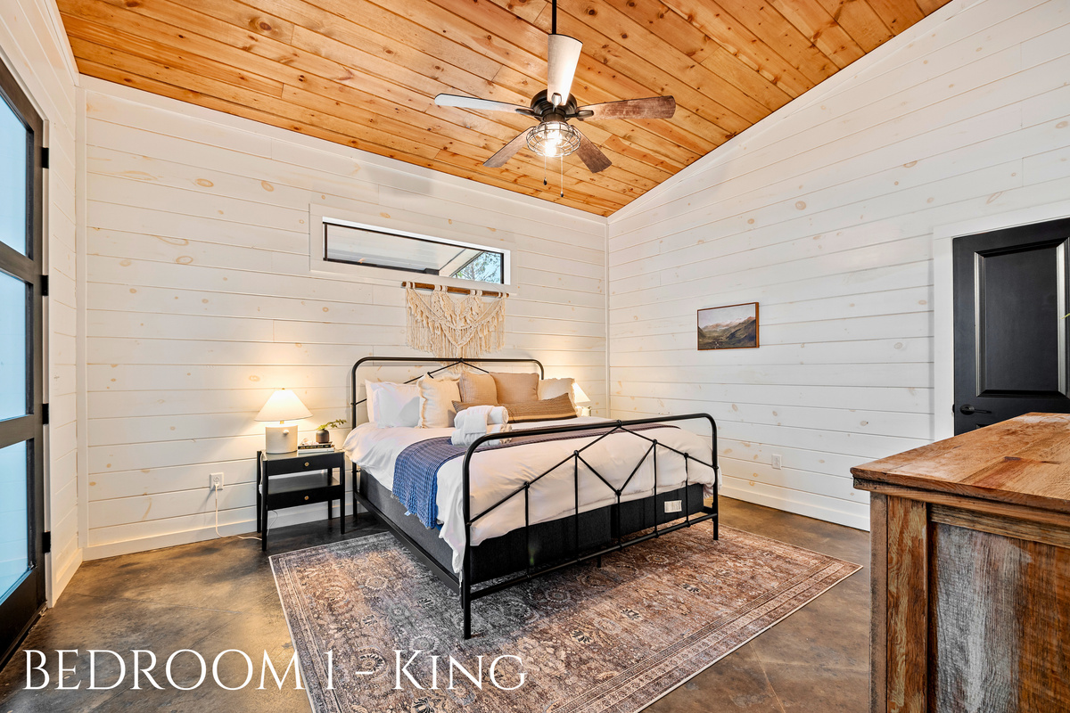 Dream a little dream in our King Bedroom - a serene retreat with all the comforts of home. Rest up under the rustic beams for tomorrow's adventures!