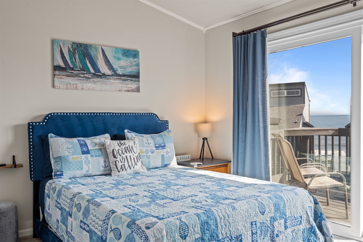 Wake up to soft coastal colors, a plush bed, and sliding doors that open to your own balcony with ocean views