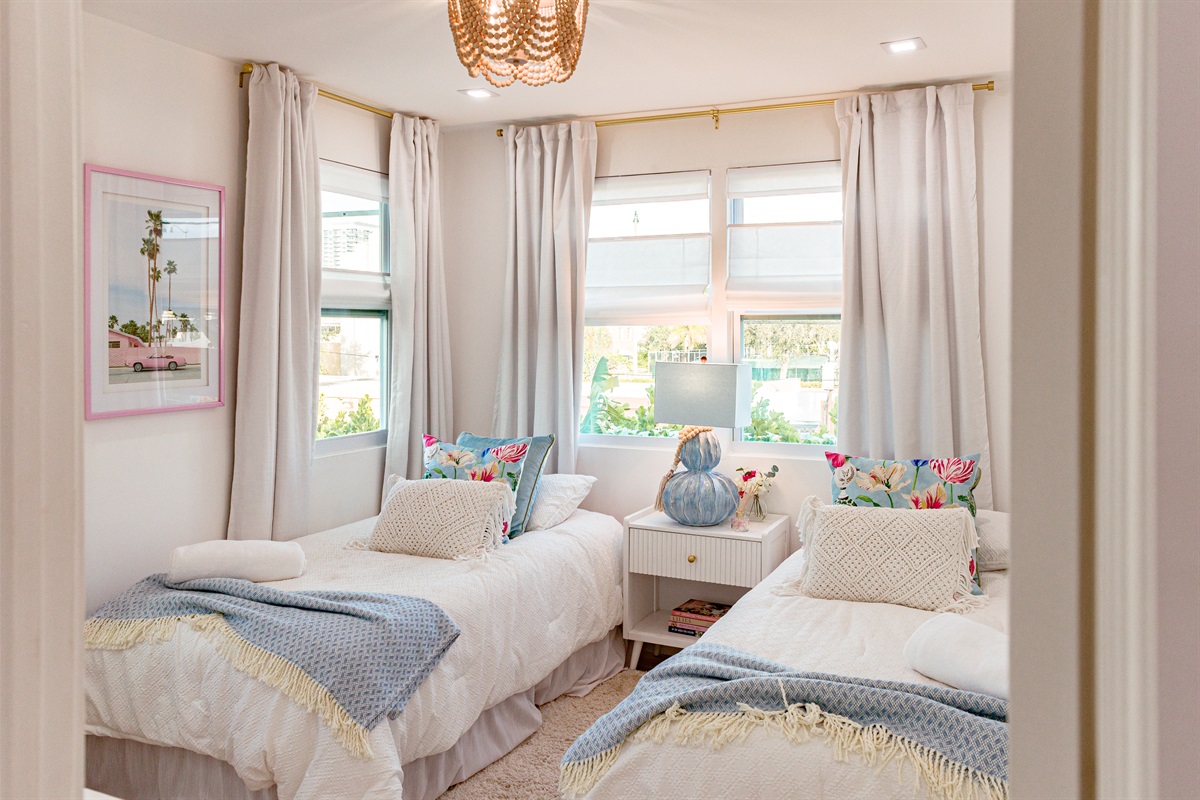 Our first cottage bedroom features two double beds, stylishly designed and very comfortable.