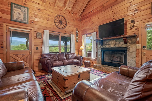 Spacious living room to relax by the gas log fireplace.