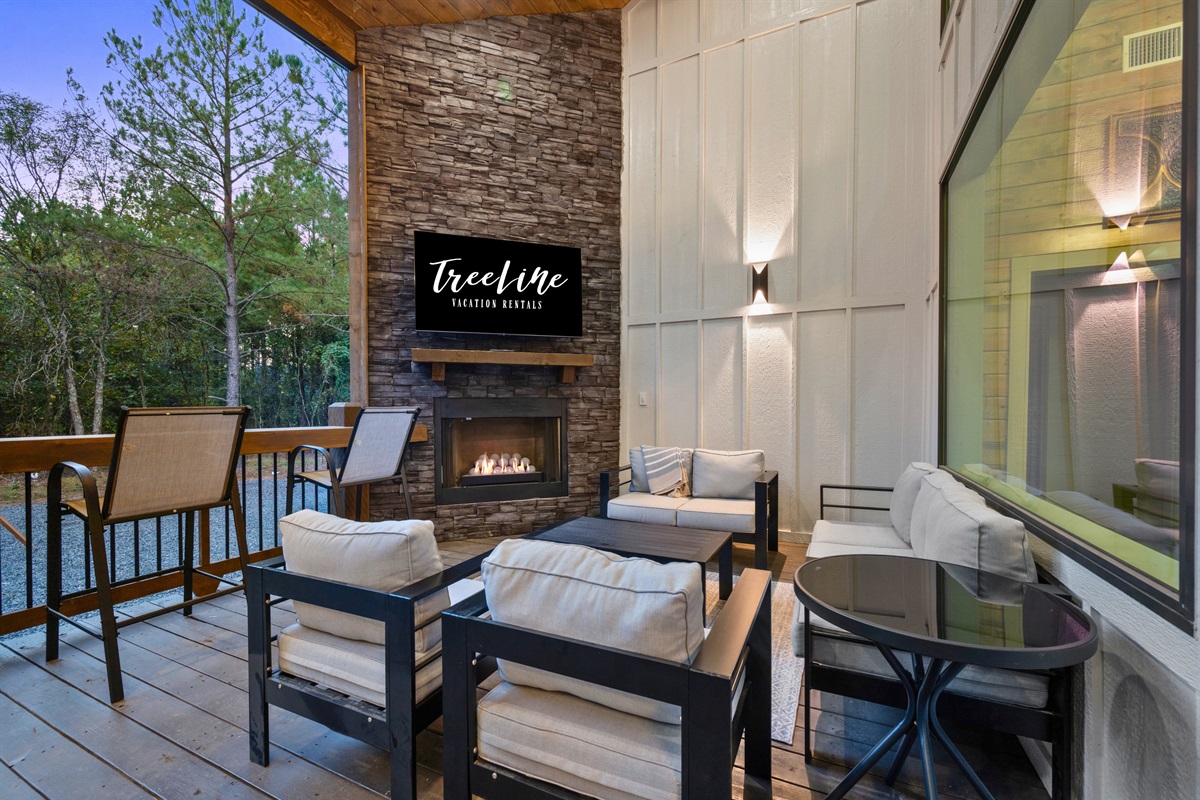 The covered outdoor fireplace is perfect for slow mornings with coffee or evenings spent under the stars.