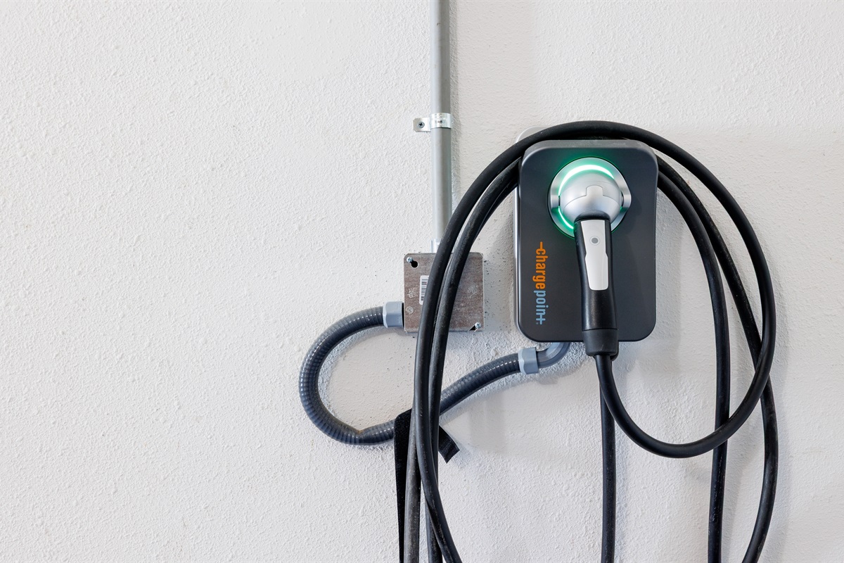 EV charger with free charging for registered guests
