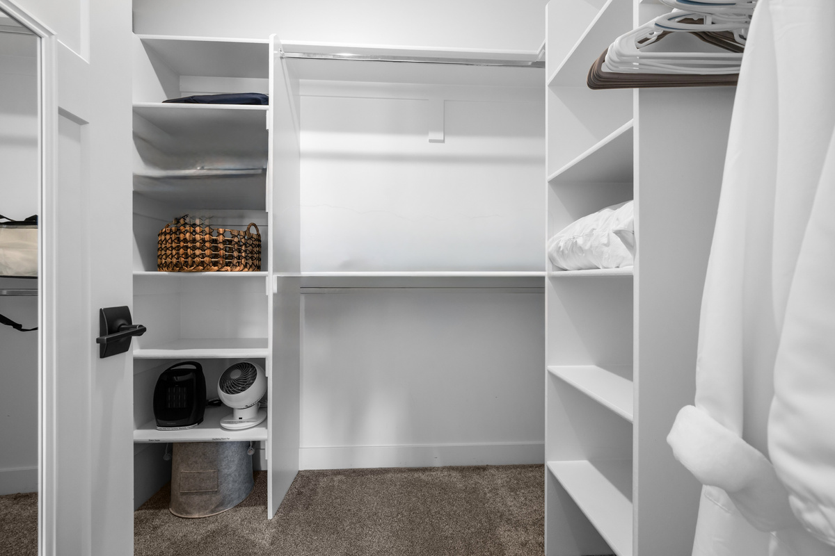 Spacious walk-in closet provides generous storage for luggage, ski gear, and everything you'll need during your stay.