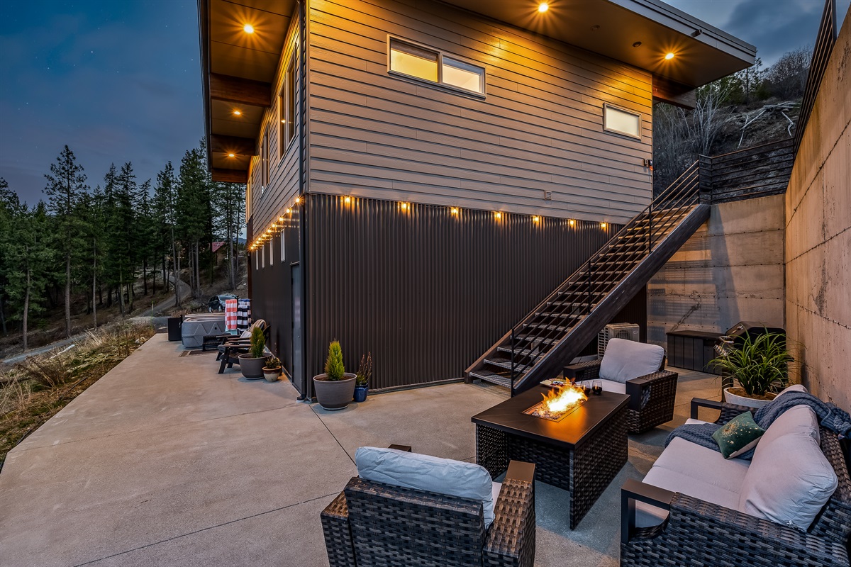 Outdoor lounging with fire table and gas BBQ, both with propane provided, additional seating and hot tub for 4 people