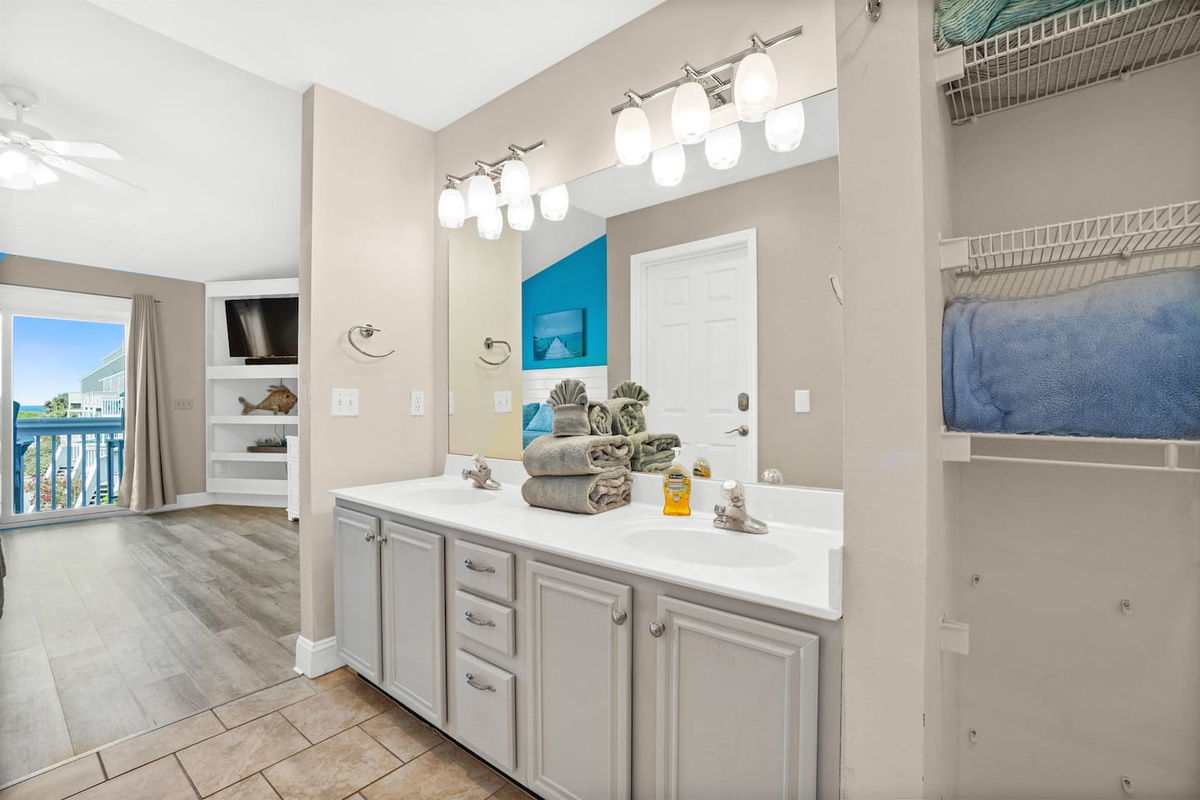 Start your morning at the double vanity &mdash; enough room for two, zero fighting for mirror space.