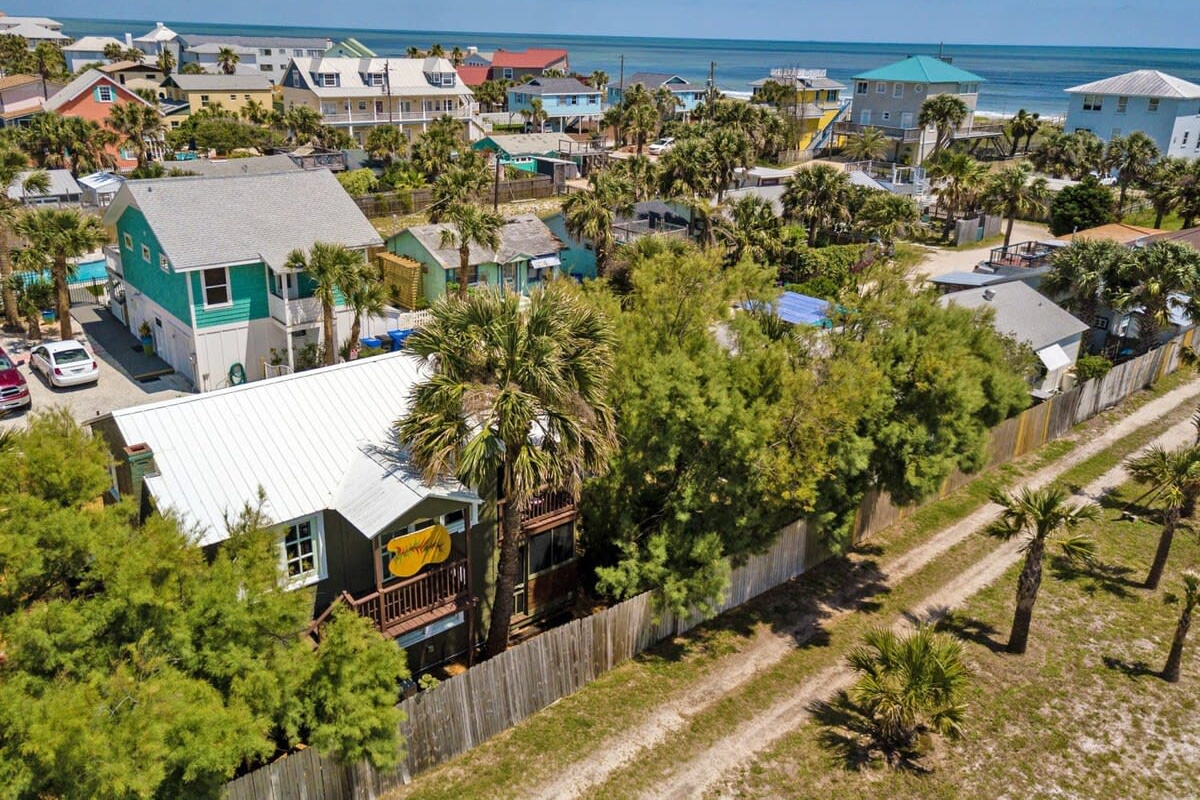From above you can see how close the Atlantic really is: a short walk from the door and you are standing on the sand. Vilano rooftops, palms and dunes running all the way down to the edge of the water.
