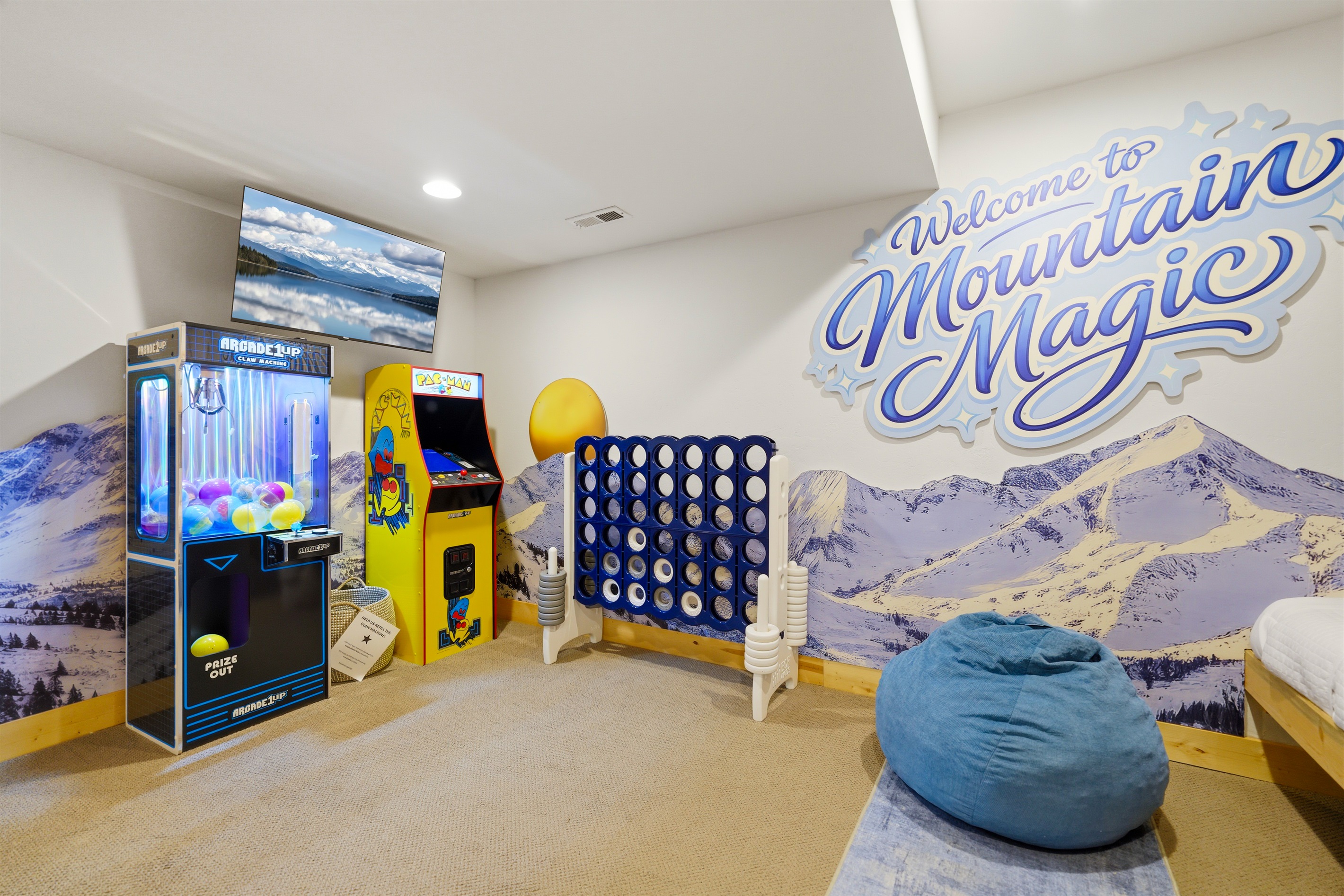 The bunk room also has playful touches like a claw machine, Connect 4, and an arcade game.
