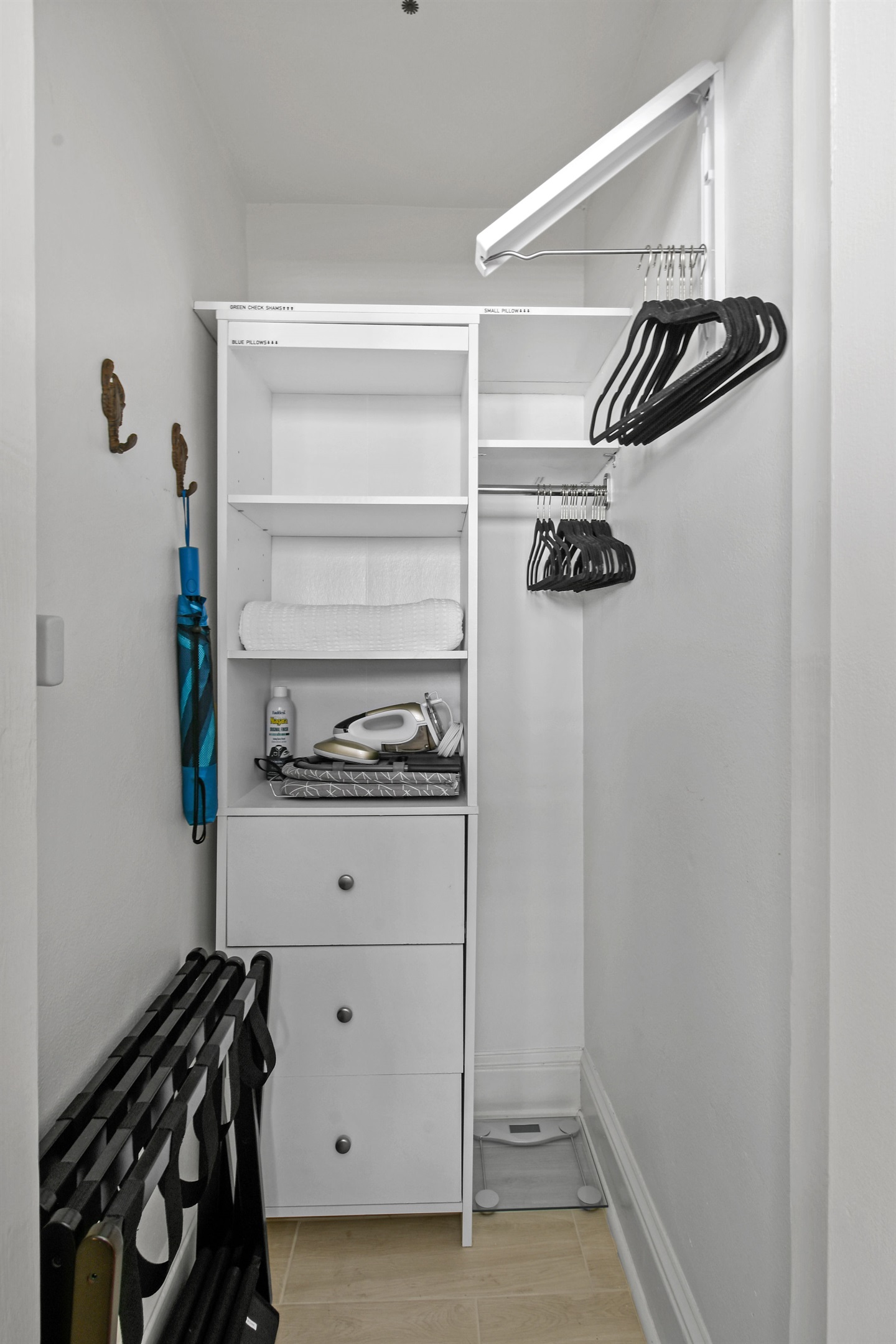 2 Luggage Racks, Lots of Hangers, Iron/Board, Umbrella, Scale, Blanket, Grocery Bags, Decorative Pillow Storage