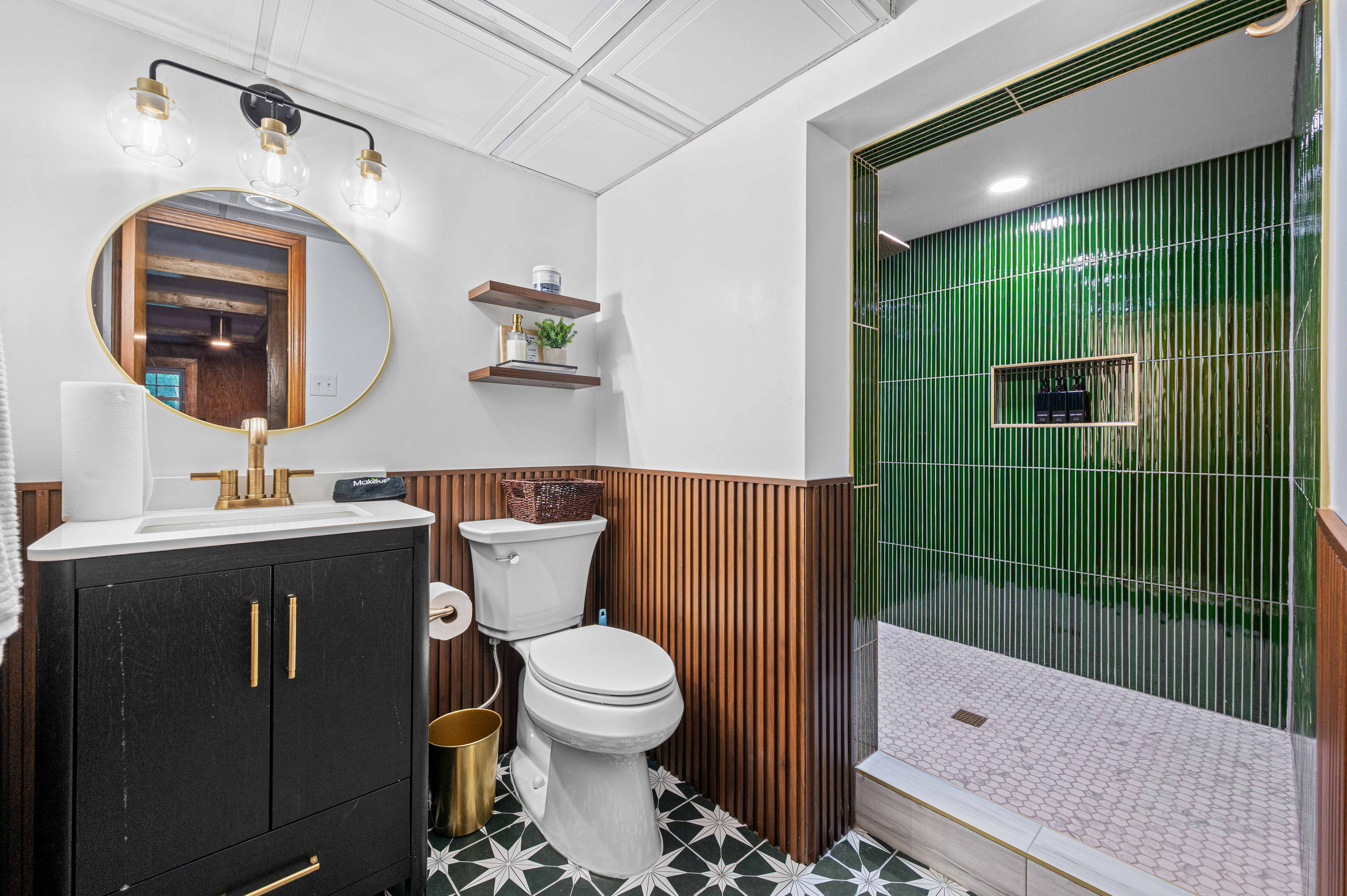 Stylish Bathroom Oasis: Indulge in modern elegance with a stunning green tiled shower!