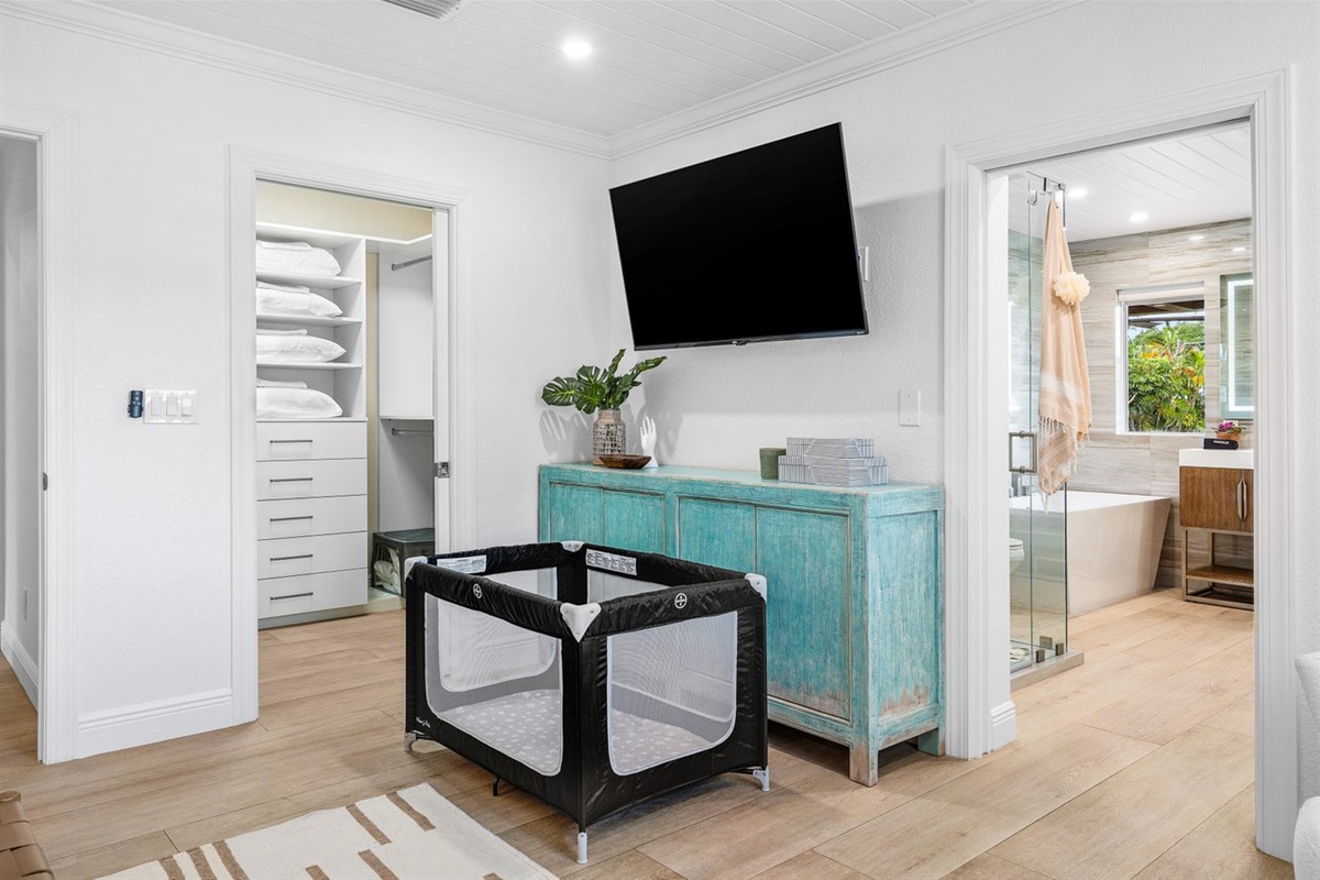 Family-friendly comfort meets style with a thoughtfully placed crib and easy access to a spacious walk-in closet and spa-like bath.