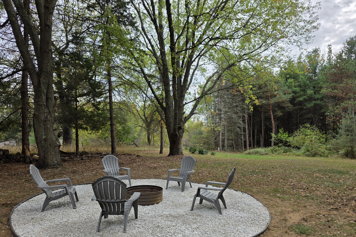 Backyard firepit with Adiondack chairs