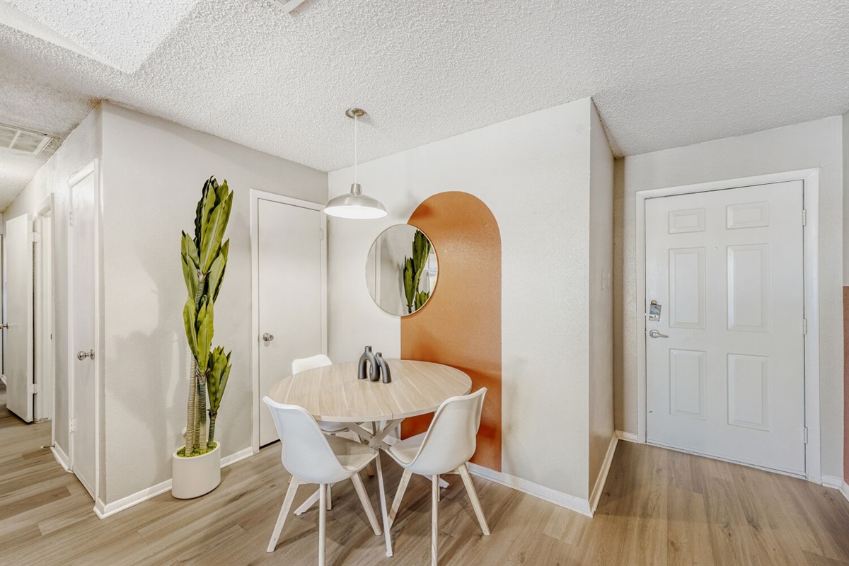 Bright, modern dining nook with a pop of color and natural charm.