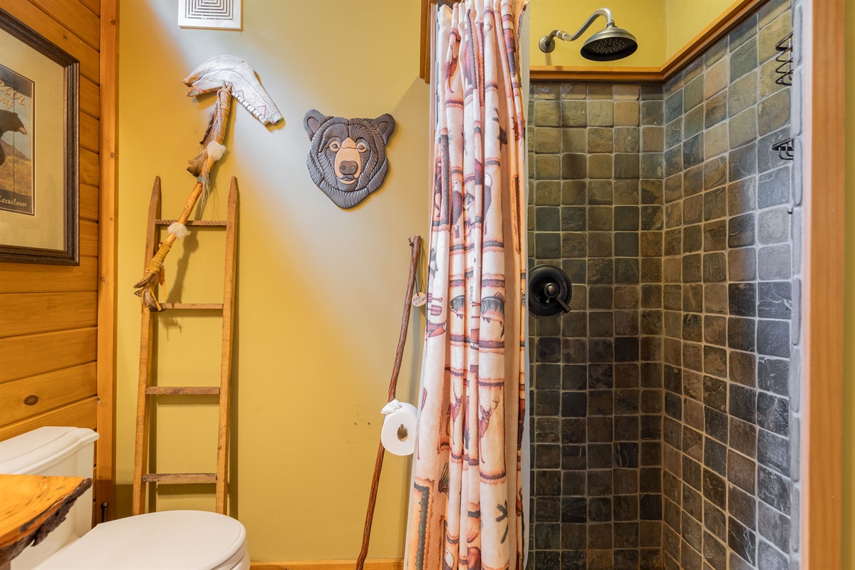 The ensuite bathroom features a beautifully tiled shower, offering both comfort and style during your stay.