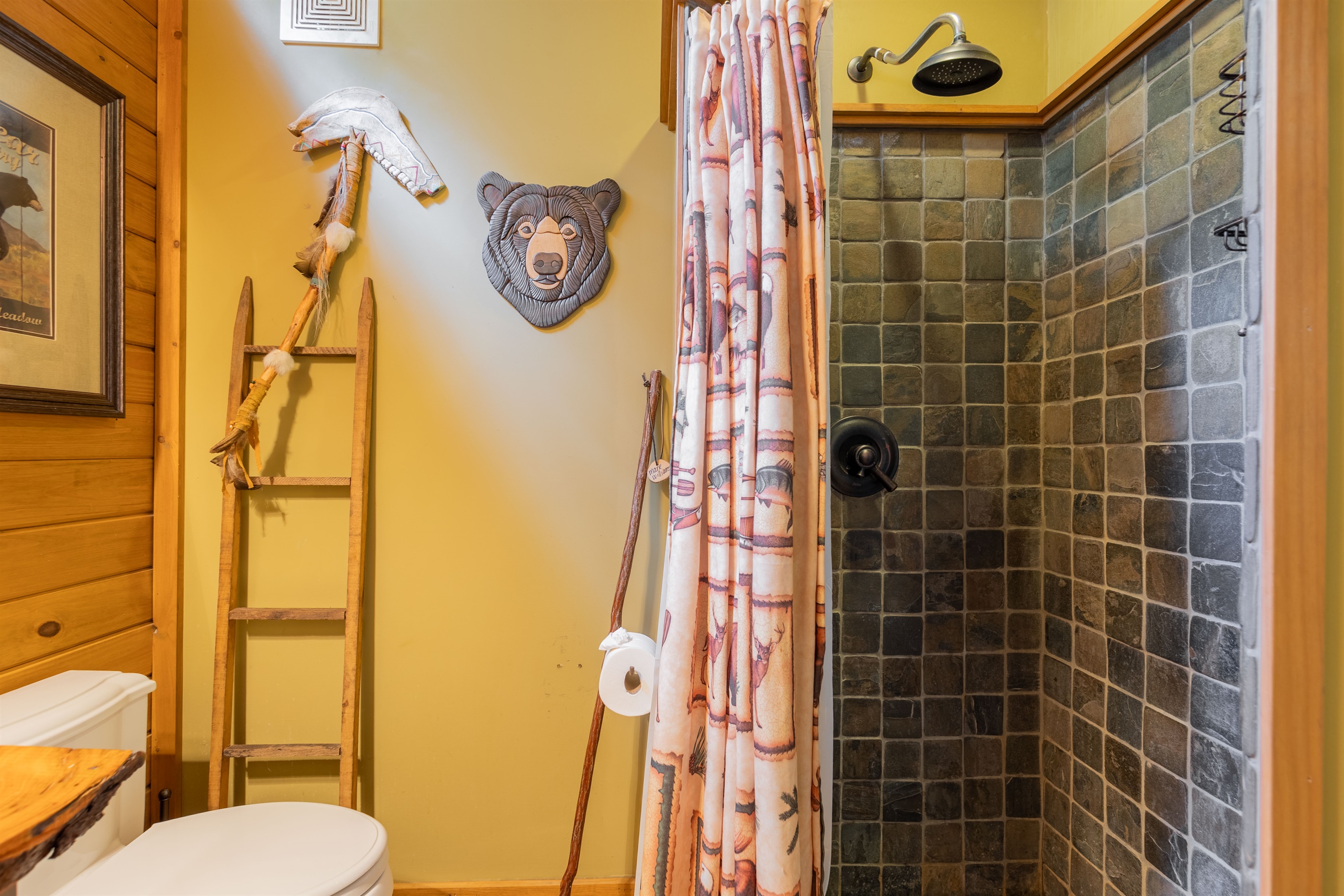 The ensuite bathroom features a beautifully tiled shower, offering both comfort and style during your stay.