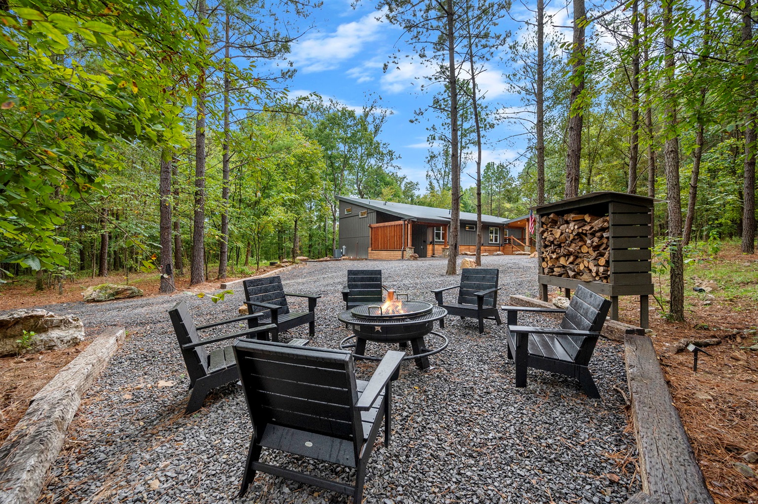 Stay Rooted: wooded cabin setting with a private fire pit.