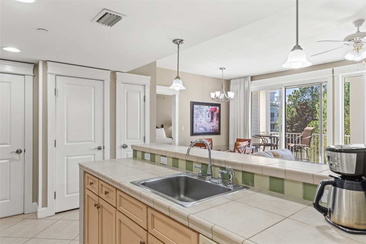 Kitchen Overlooks Living to Balcony
