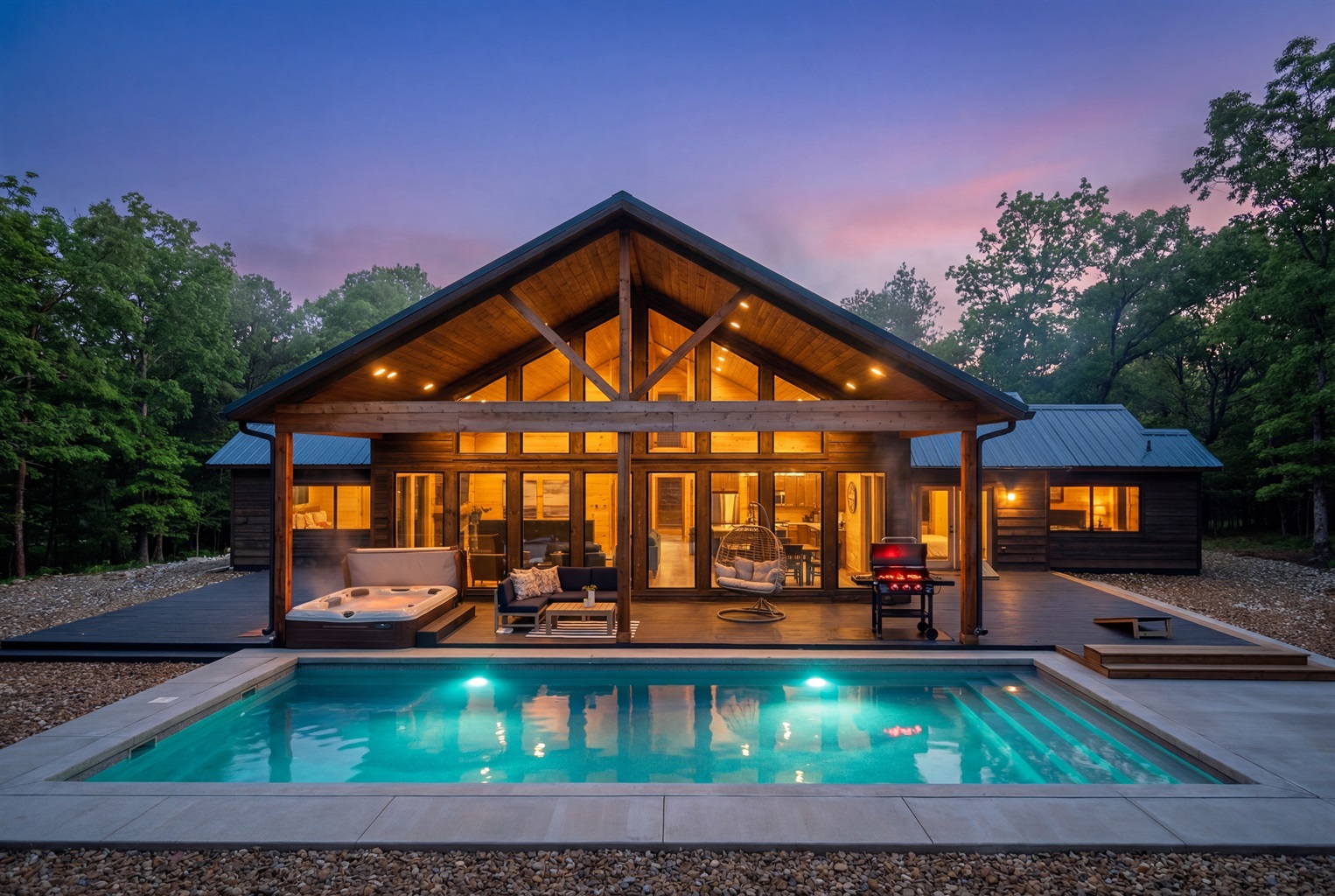 Private pool and hot tub at dusk. Pool heating is available Nov–Apr for $100/night, with a 2-night minimum; request in advance.