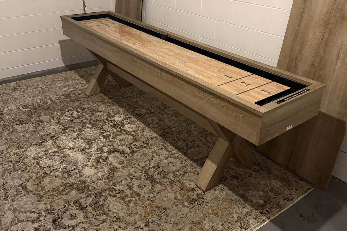 Challenge your crew to a game of shuffleboard—another fun way to spend evenings at the house.