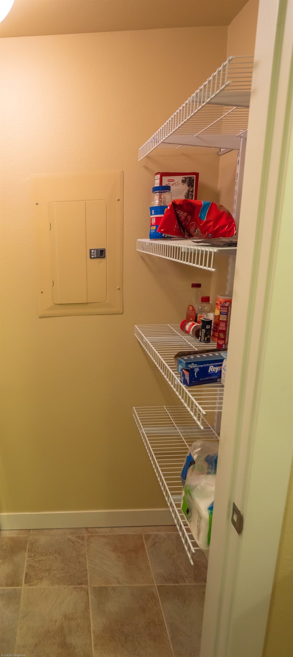 wire shelves provide ample storage in pantry