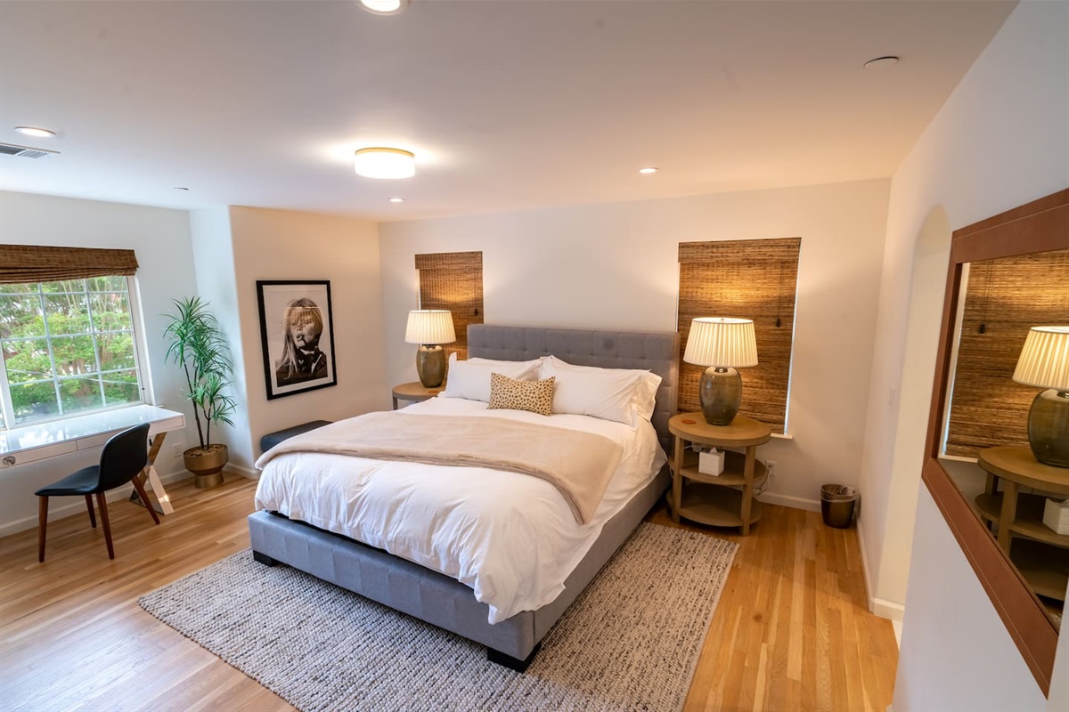 Primary bedroom with king bed and smart TV