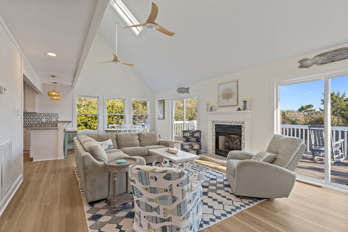 Vaulted ceilings, natural light, and relaxed seaside details create the perfect setting to unwind after a day at the beach