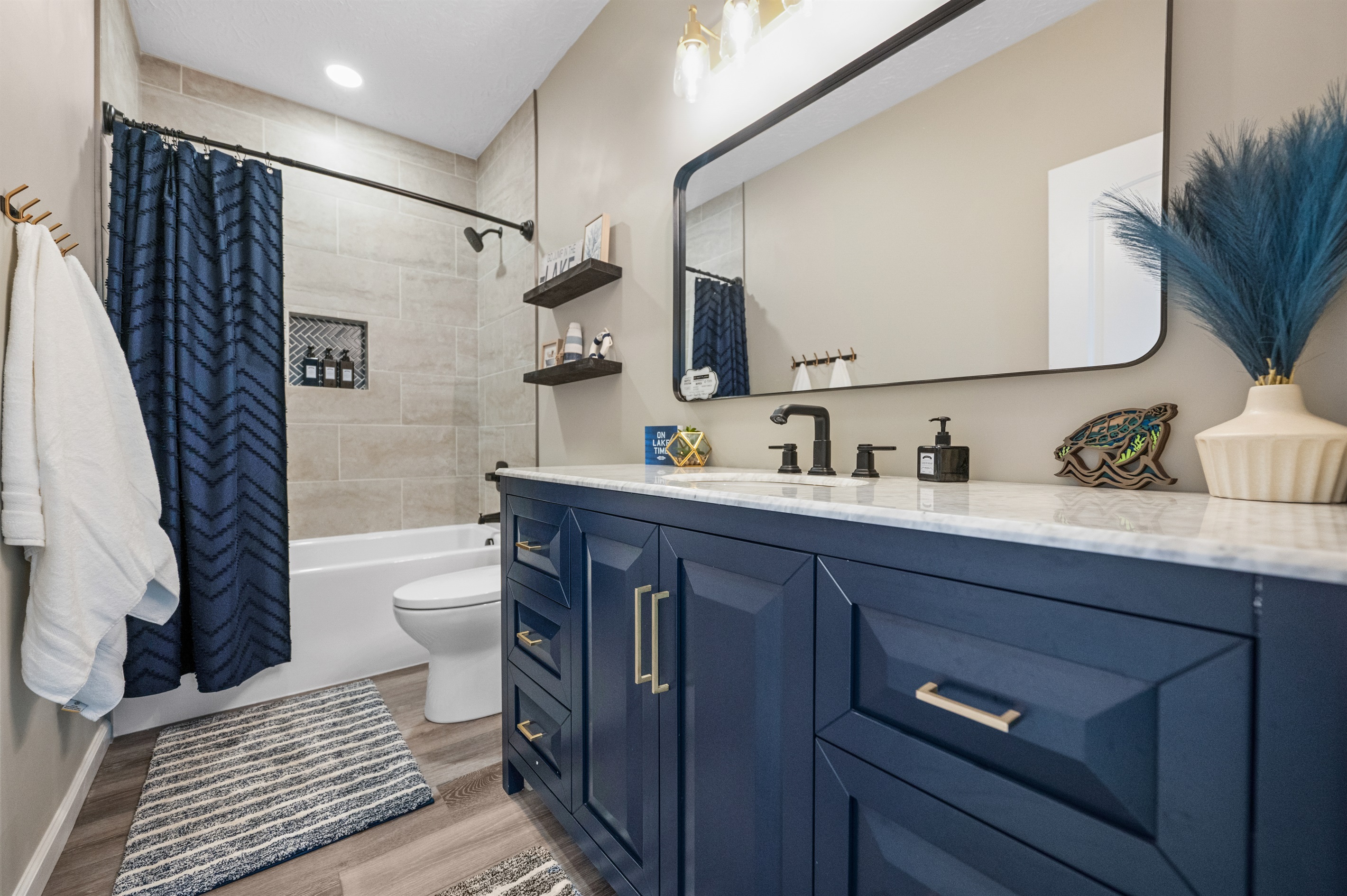Full bath located upstairs. Provided items include shampoo, conditioner, body wash and a few starter rolls of toilet paper. The bathroom vanity contains towels, washcloths, hand towels, and makeup cloths.