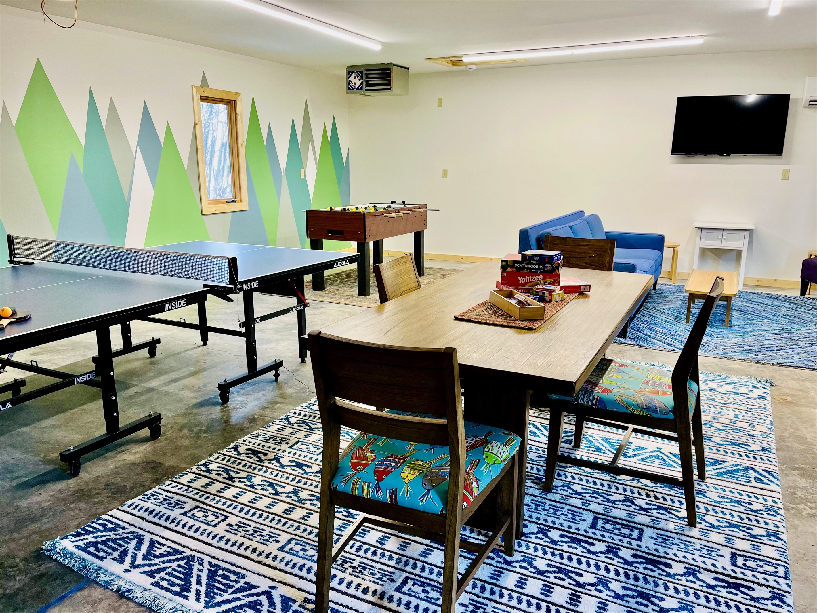 The new garage game room is perfect for unwinding after a day of adventure. Play ping pong, foosball, or a card game—fun and friendly competition for everyone!