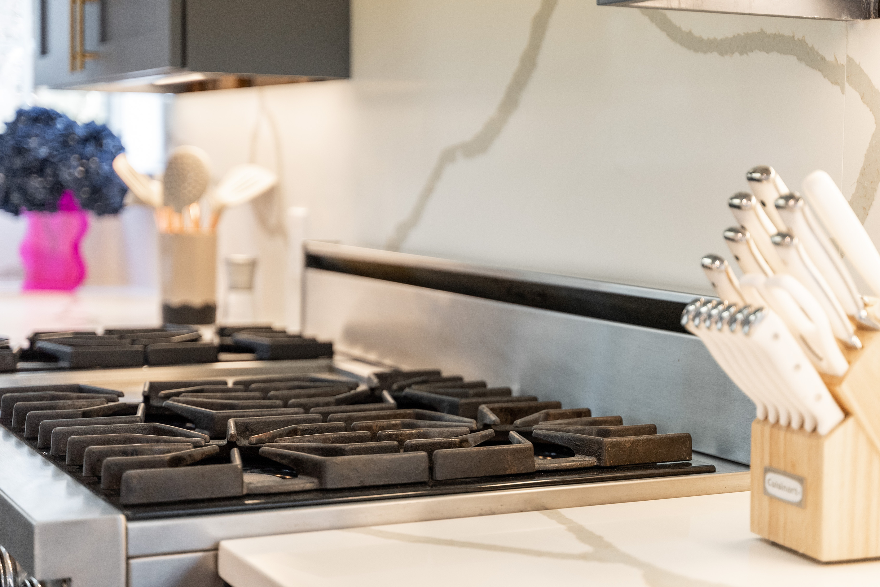 Sharp knife set and marble counters make meal prep effortless.