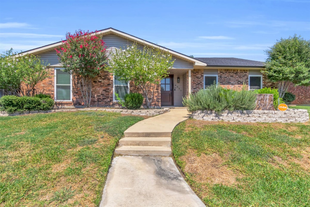 Charming brick exterior sets the tone for warm and welcoming stay!