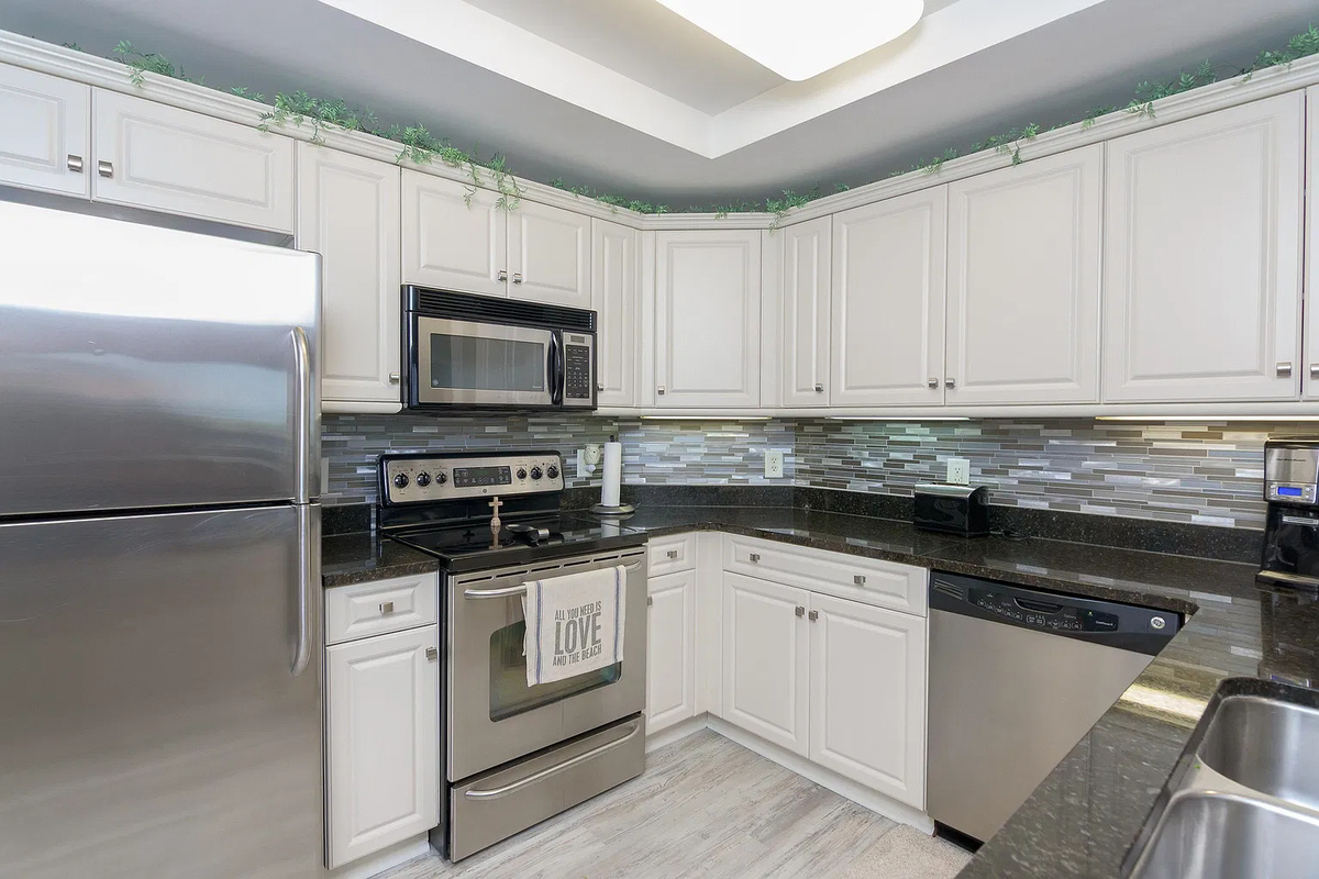 Well stocked kitchen with stainless Steele appliances and all you need for meal preparation