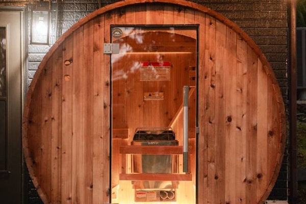 Relax and recharge in the ‘Almost Heaven Sauna,’ a peaceful nature retreat.