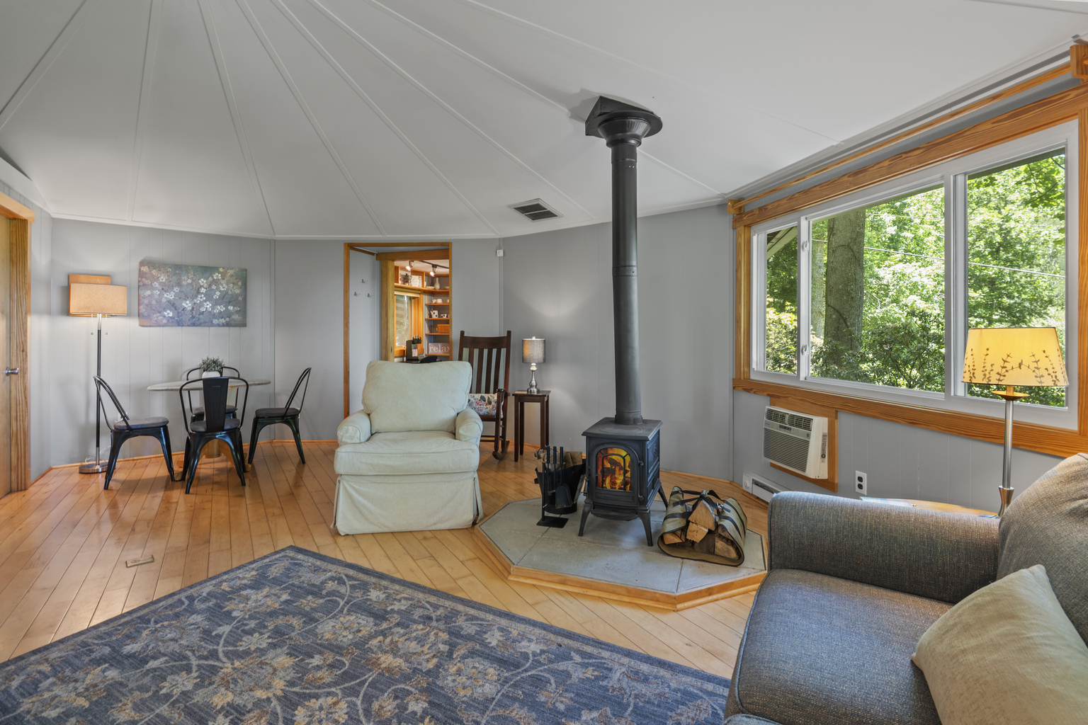 Cozy, yet open living area; we stock supplies for the woodstove in winter
