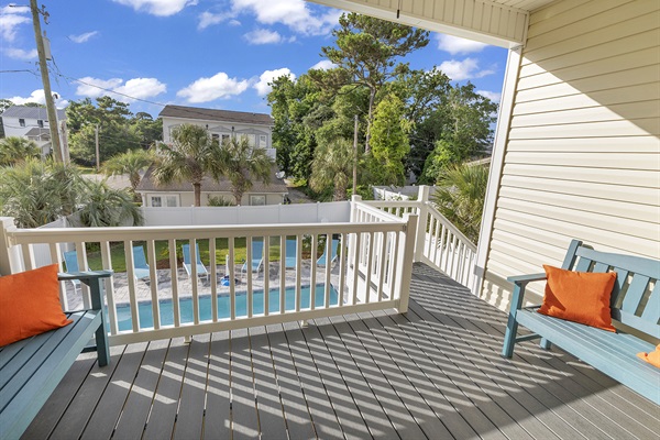 Step into relaxation paradise on our outdoor patio overlooking the shimmering swimming pool. Whether you're soaking up the sun's warmth or enjoying a refreshing breeze, this is the perfect spot to unwind and take in the serene beauty of your surroundings.