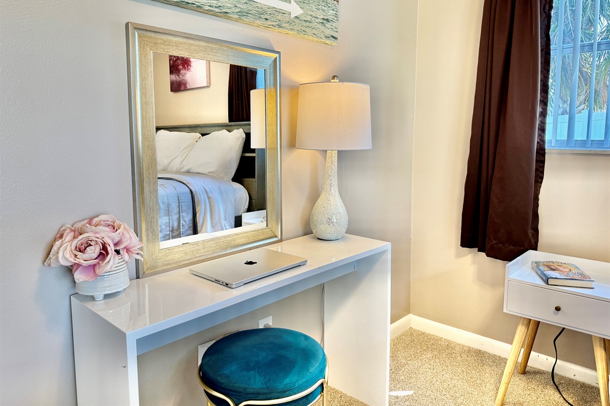 This quiet corner of the home offers everything you need for a comfortable stay—plush bedding, functional storage, and soft, calming hues.