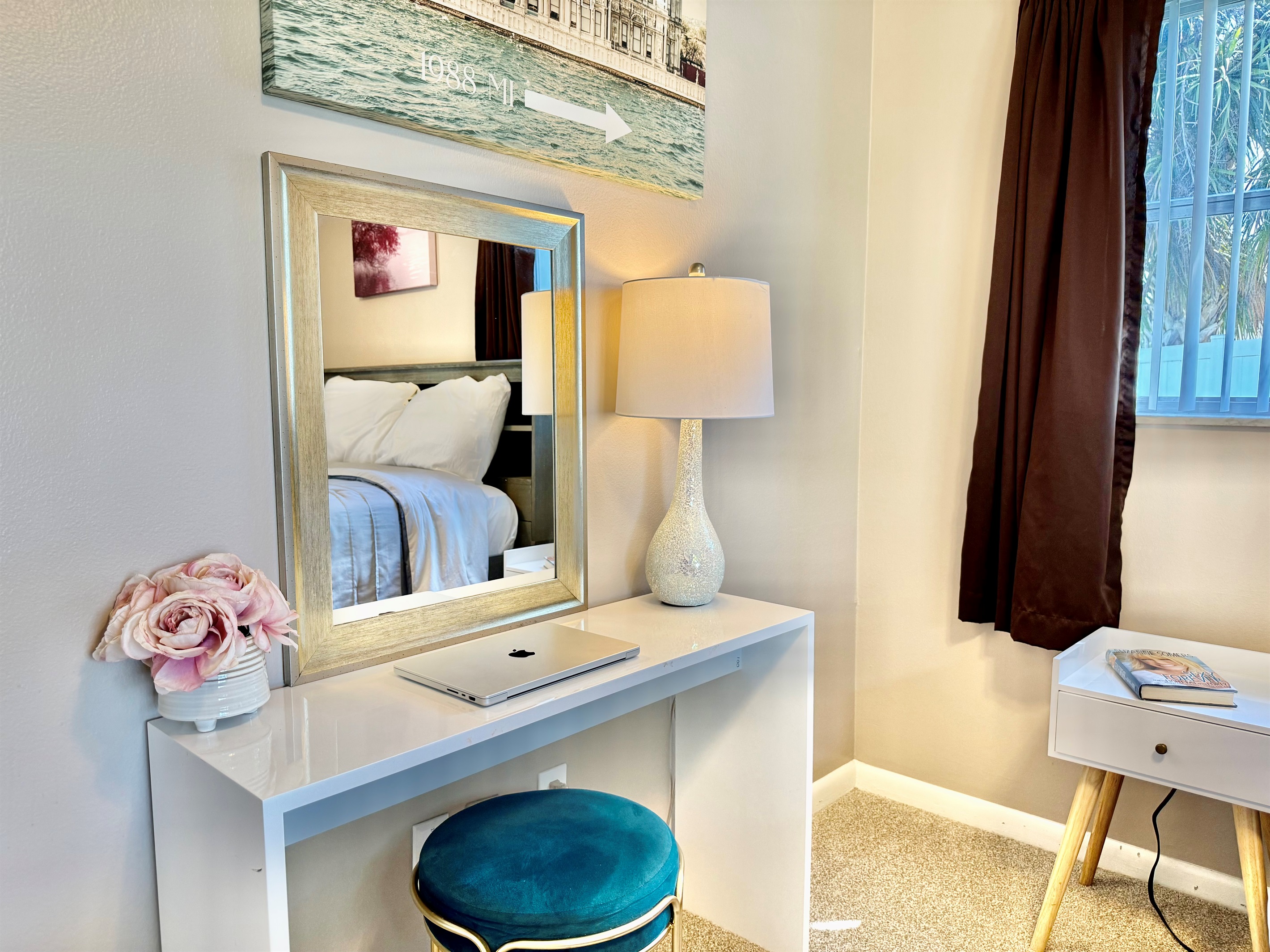 This quiet corner of the home offers everything you need for a comfortable stay—plush bedding, functional storage, and soft, calming hues.