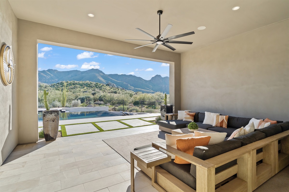 Amazing pocket doors open to the gorgeous outside with pool and views.  a