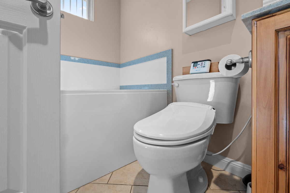 The primary bathroom includes a modern bidet toilet for added comfort and convenience, along with a soaking tub to relax after a day of adventure in Ogden Valley.